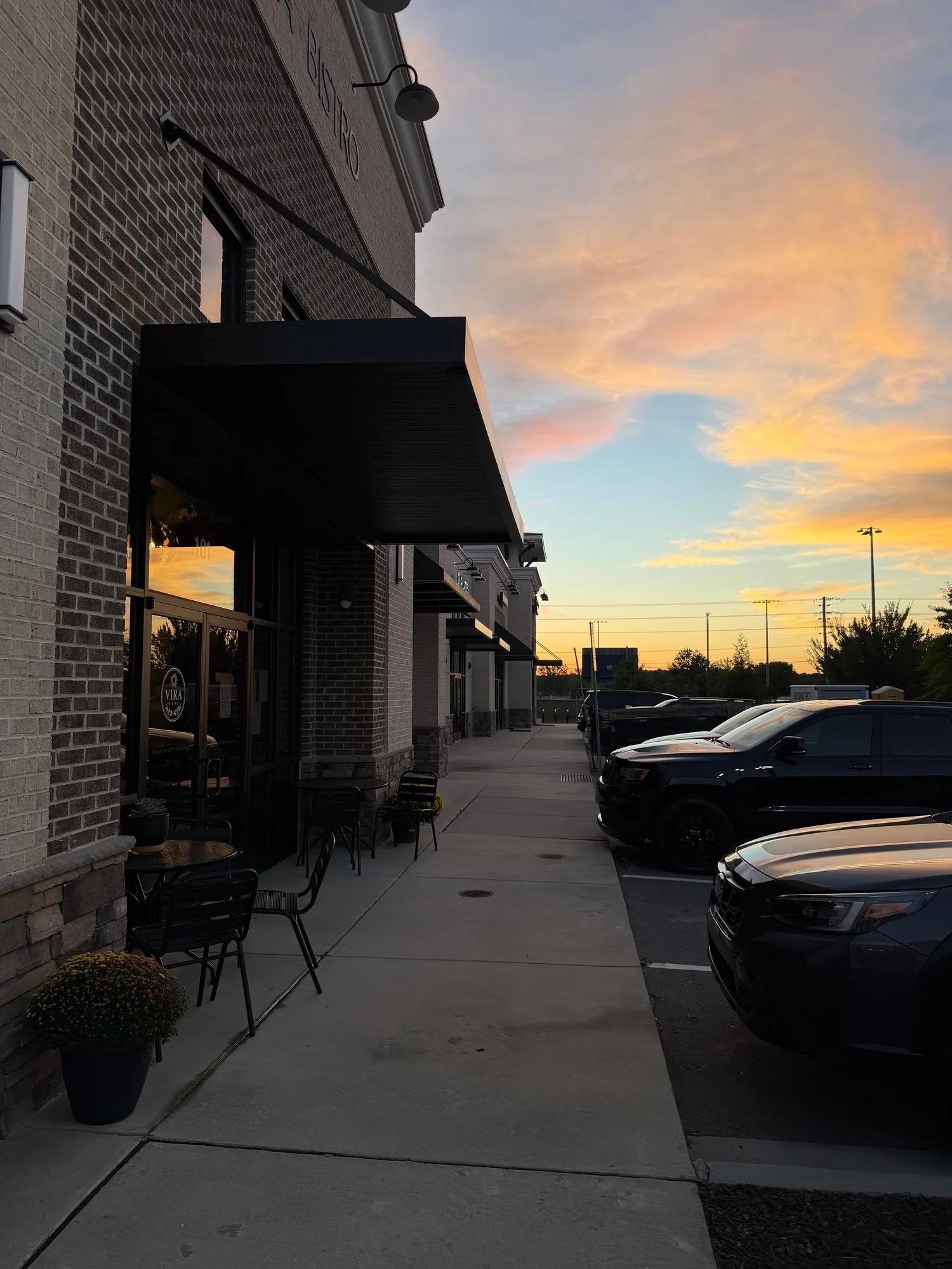 The sidewalk outside Vira Bistro at sunset